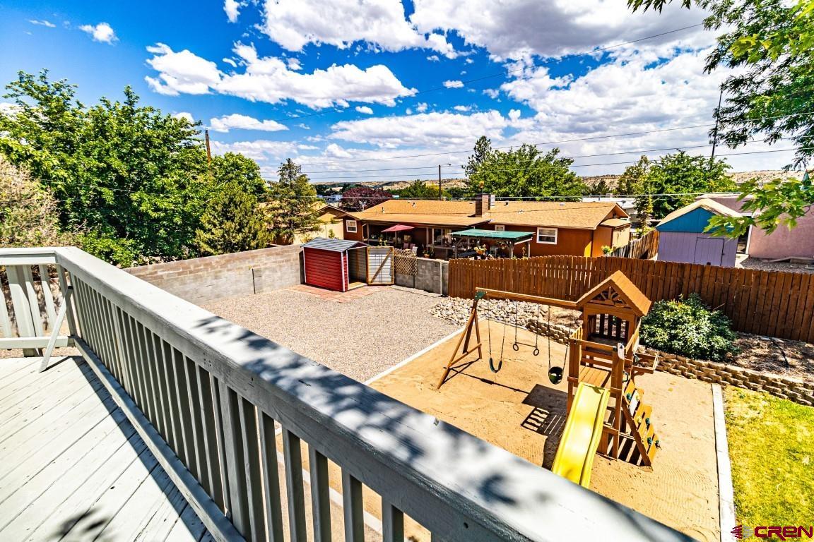 5705 Ravella Drive Farmington, NM 87402 - Photo 32 of 35 a view of a chairs and table on the balcony