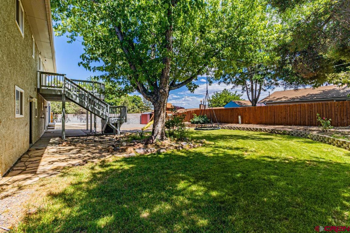 5705 Ravella Drive Farmington, NM 87402 - Photo 35 of 35 a view of a backyard with a tree
