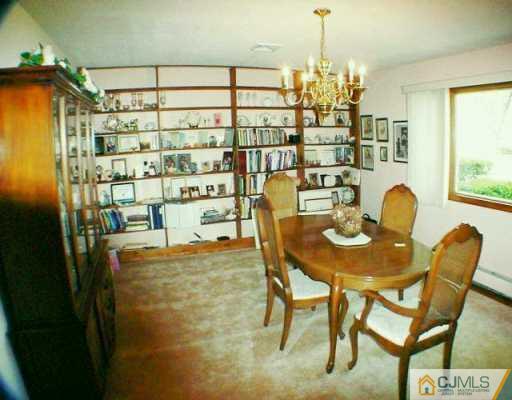 5 Conerly Road Somerset, NJ 08873 - Photo 3 of 8 a view of a dining room with furniture and a chandelier