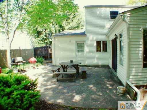 5 Conerly Road Somerset, NJ 08873 - Photo 8 of 8 a view of a backyard with sitting area