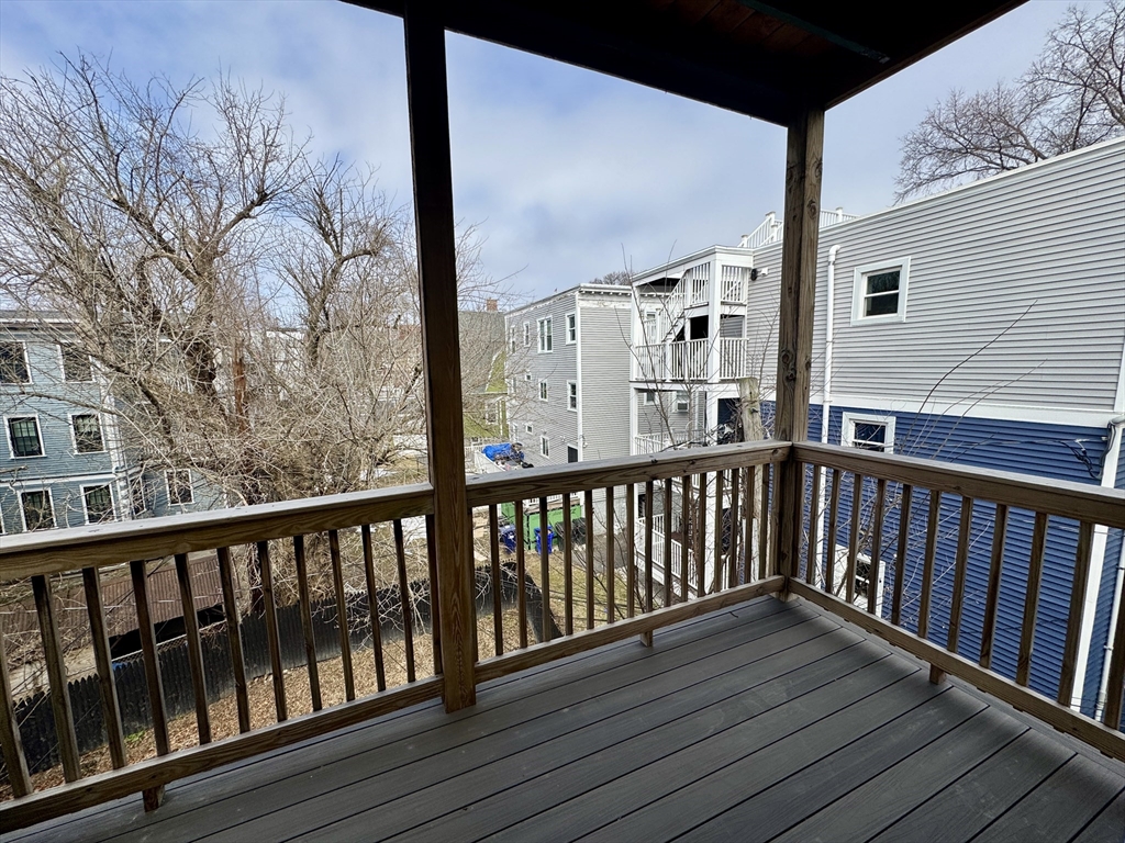 567 Park Street, Unit 3 Boston, MA 02124 - Photo 11 of 11 a view of a balcony with wooden floor