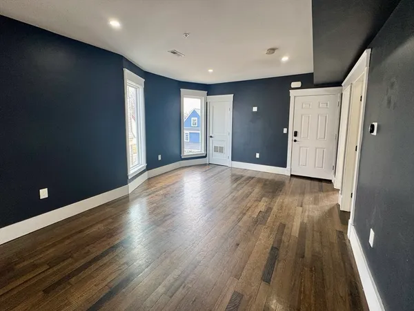 a view of a livingroom with wooden floor