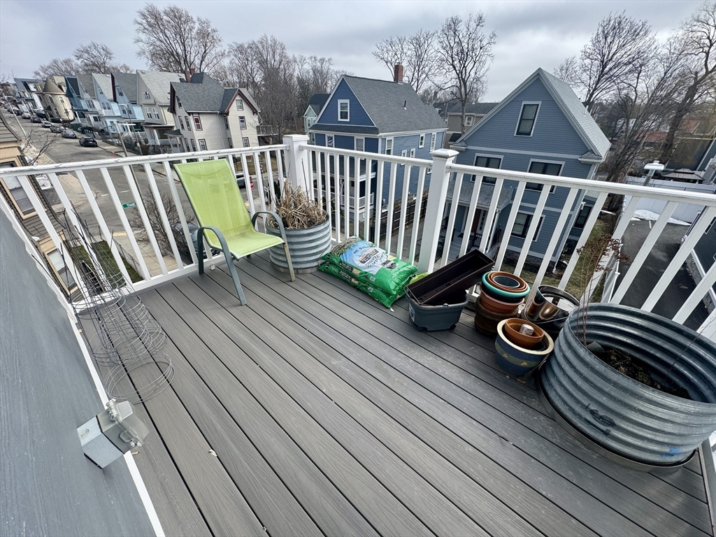 567 Park Street, Unit 3 Boston, MA 02124 - Photo 10 of 11 a view of balcony with wooden floor