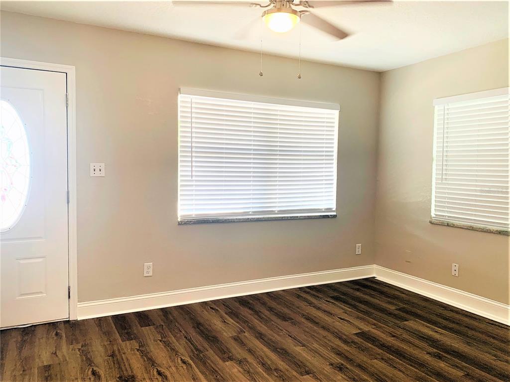 3805 West Leona Street, Unit 1 Tampa, FL 33629 - Photo 3 of 10 a view of an empty room with wooden floor and a window