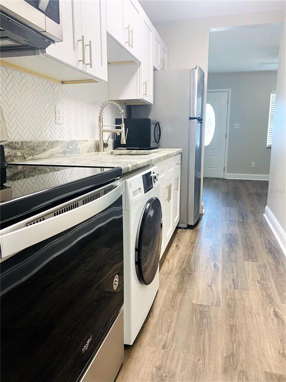 3805 West Leona Street, Unit 1 Tampa, FL 33629 - Photo 5 of 10 a view of kitchen and washer and dryer