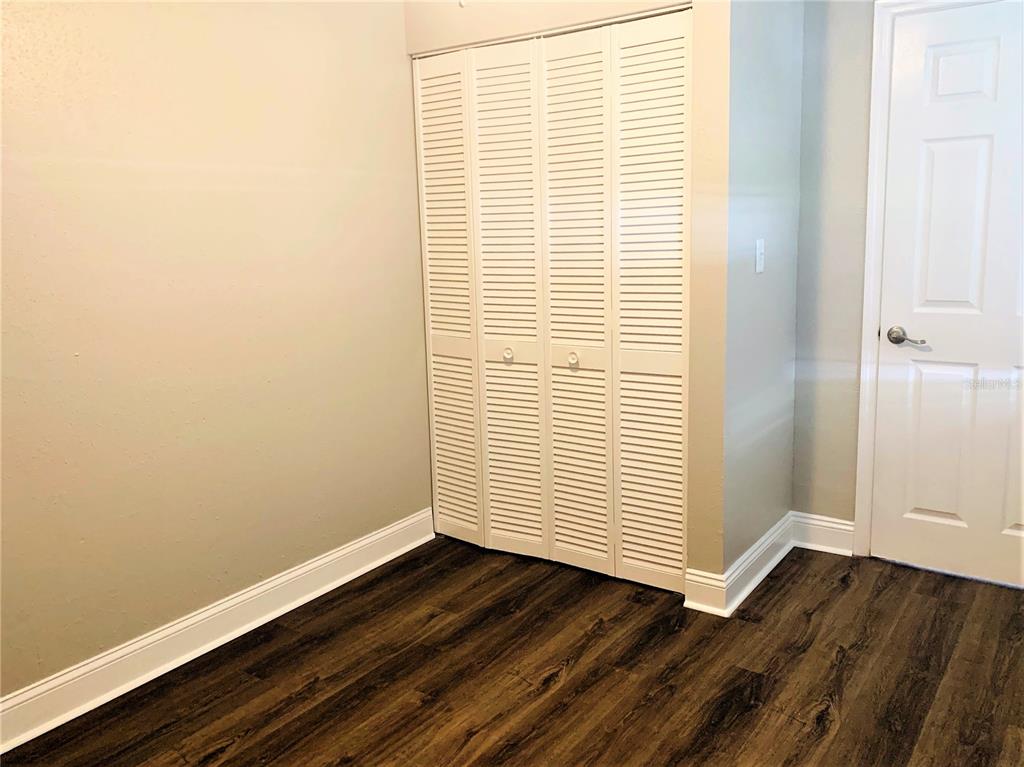 3805 West Leona Street, Unit 1 Tampa, FL 33629 - Photo 8 of 10 an empty room with wooden floor and a window