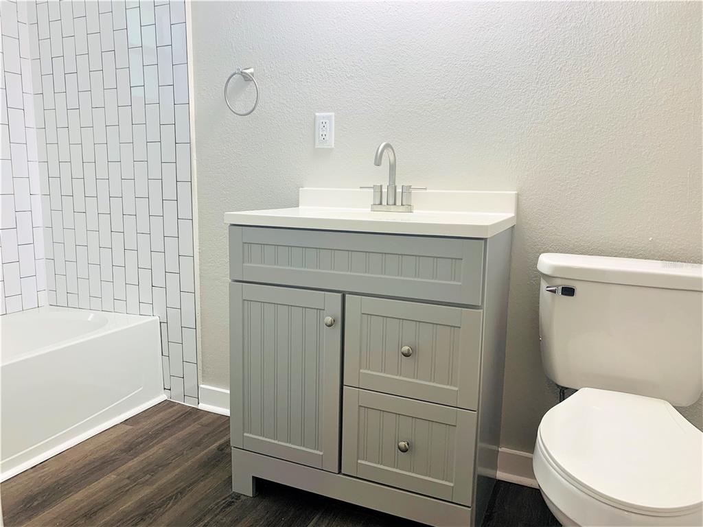 3805 West Leona Street, Unit 1 Tampa, FL 33629 - Photo 9 of 10 a bathroom with a sink a toilet and bathtub