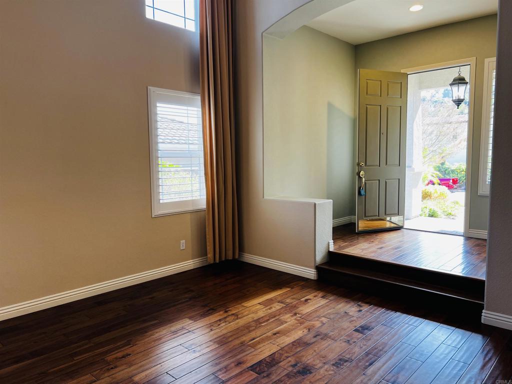 2834 Rancho Pancho Carlsbad, CA 92009 - Photo 16 of 73 a view of room with wooden floor and window