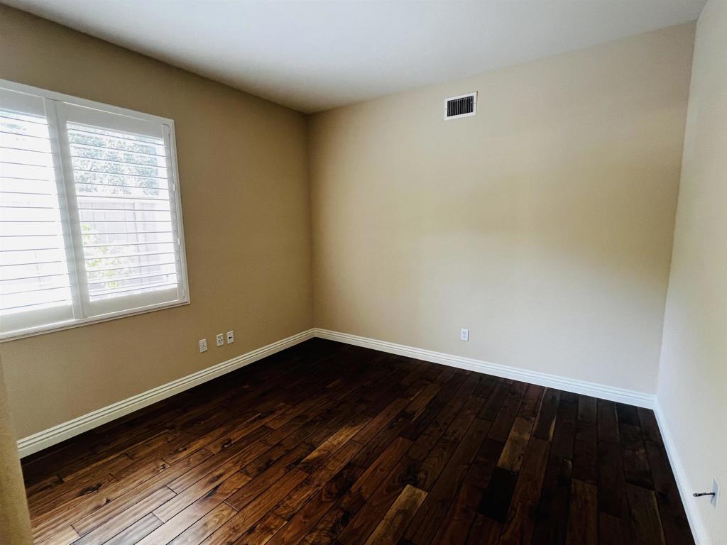 2834 Rancho Pancho Carlsbad, CA 92009 - Photo 27 of 73 a view of a room with wooden floor and a window