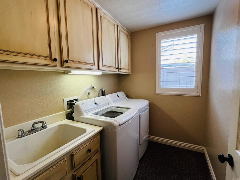 2834 Rancho Pancho Carlsbad, CA 92009 - Photo 32 of 73 a utility room with dryer and washer