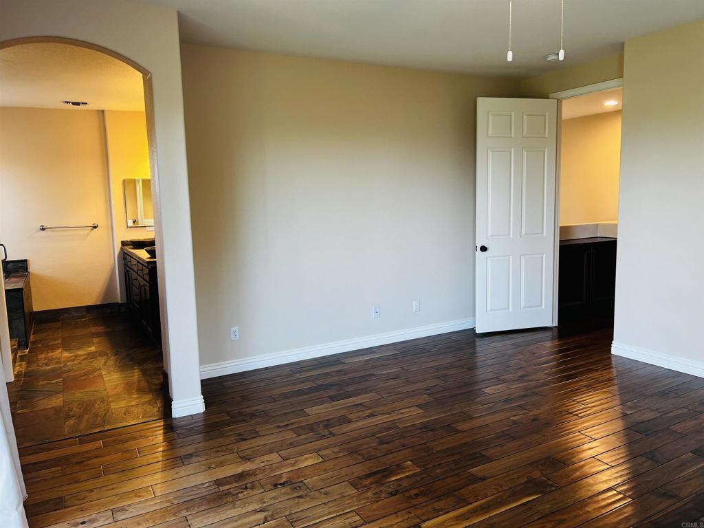 2834 Rancho Pancho Carlsbad, CA 92009 - Photo 37 of 73 a view of a room with wooden floor and a bathroom