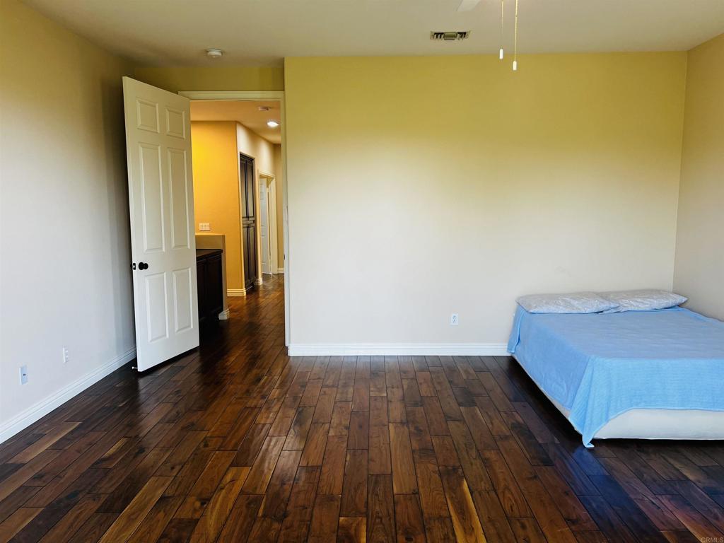 2834 Rancho Pancho Carlsbad, CA 92009 - Photo 38 of 73 a view of a room with wooden floor and a bathroom