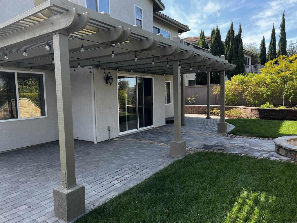 2834 Rancho Pancho Carlsbad, CA 92009 - Photo 4 of 73 a view of a house with backyard and porch