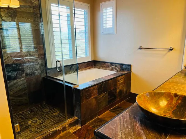 a view of a swimming pool with a patio