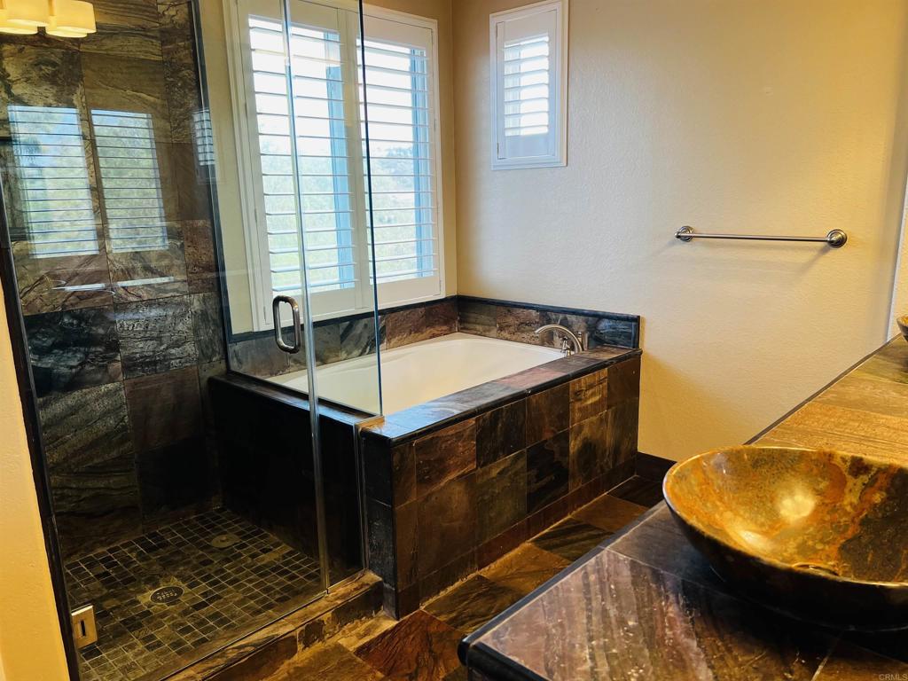 2834 Rancho Pancho Carlsbad, CA 92009 - Photo 47 of 73 a bathroom with a sink and a mirror