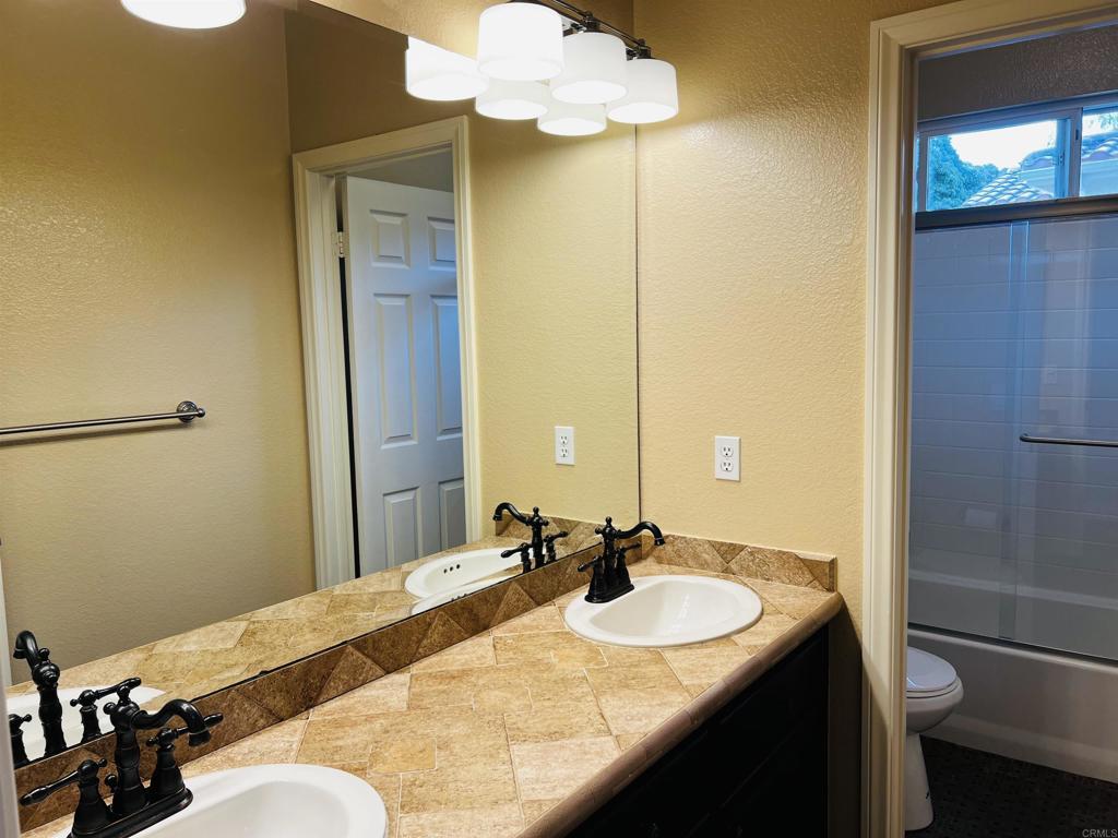 2834 Rancho Pancho Carlsbad, CA 92009 - Photo 54 of 73 a bathroom with a sink vanity granite and toilet