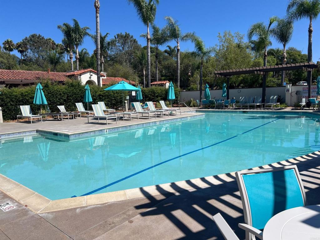 2834 Rancho Pancho Carlsbad, CA 92009 - Photo 71 of 73 a view of a swimming pool with a patio and a fire pit