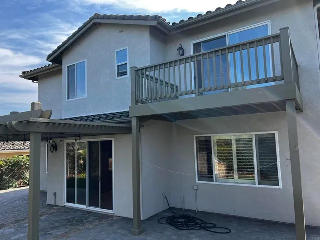 a kitchen with wooden cabinets and a stove top oven