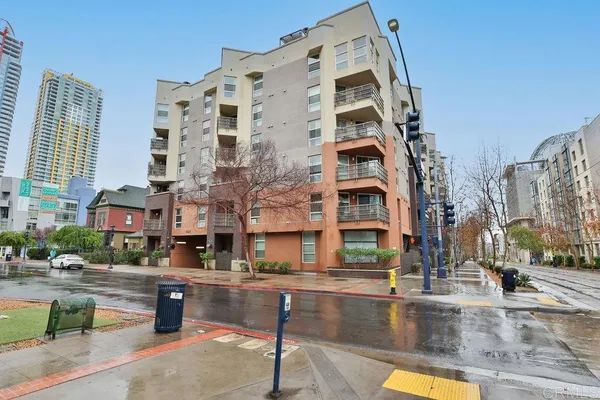 a tall building sitting on the side of a street