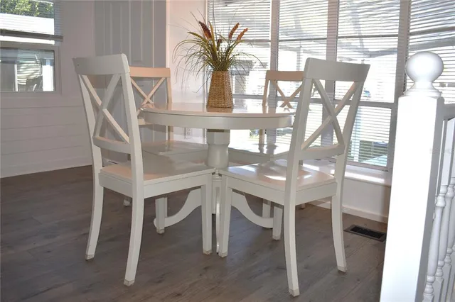 a vase of flowers sitting on a table