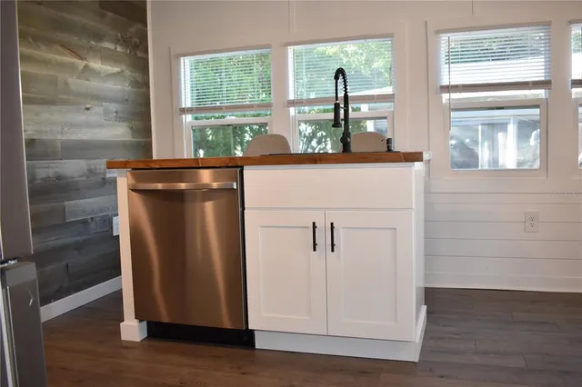 a view of washer and dryer with wooden floor