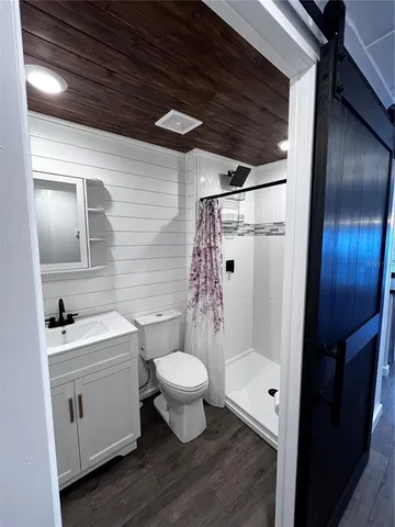 a bedroom with a bed and lamp