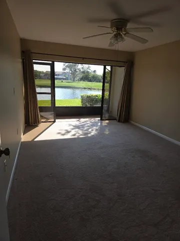 a view of a room with a large bed