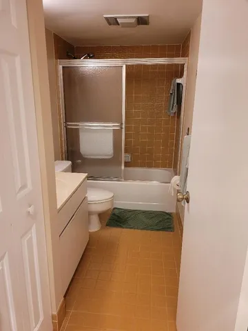 a view of a lake with houses in the back