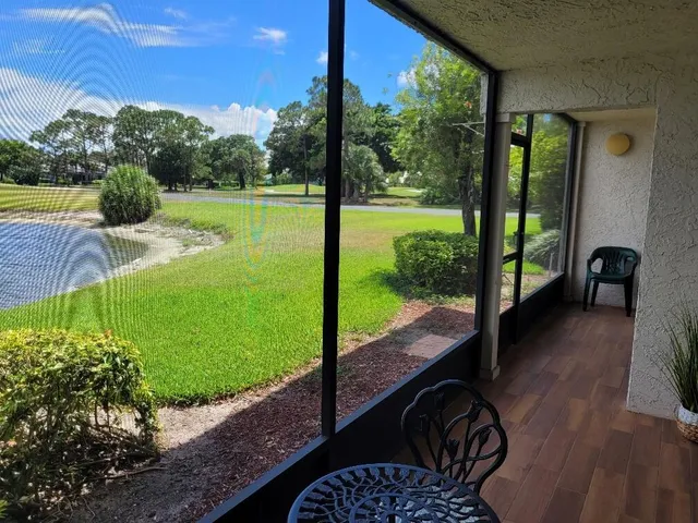 an aerial view of a house with swimming pool garden and outdoor seating