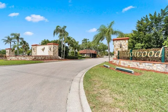 a living room with fireplace furniture and a large window