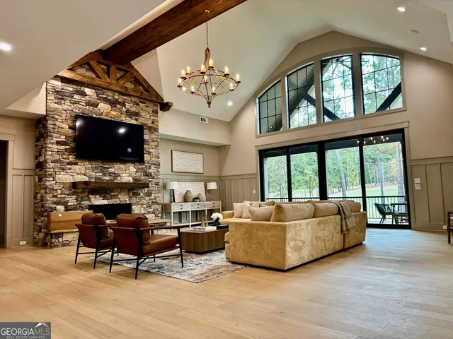 a living room with furniture ceiling fan and a rug