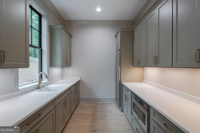 a bathroom with a shower a sink and a mirror