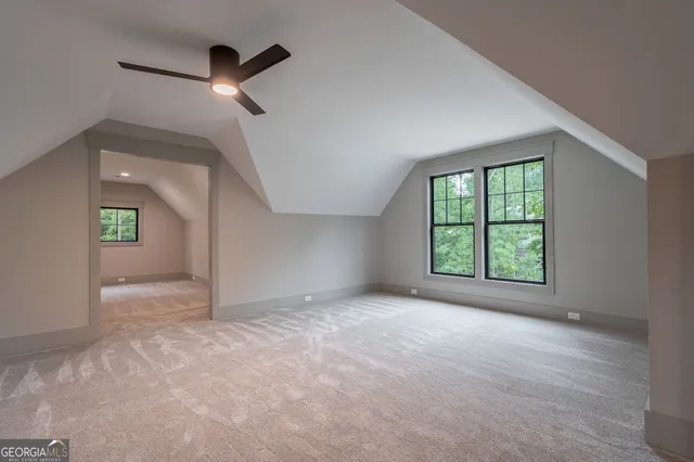 an aerial view of residential building with green space