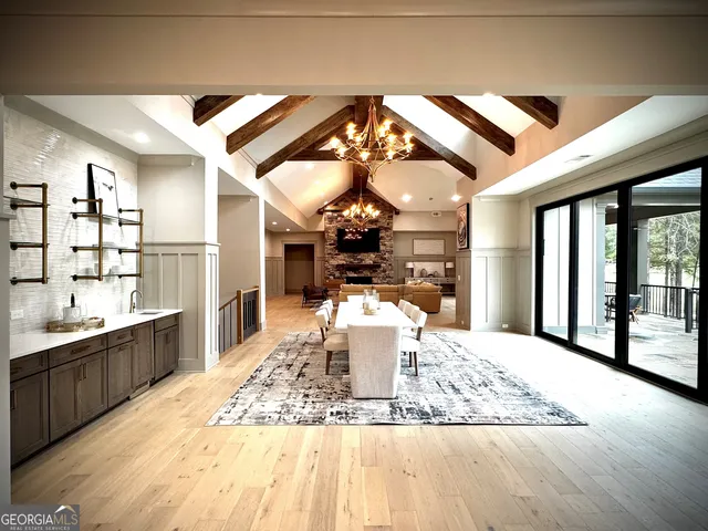 a living room with fireplace furniture and a flat screen tv