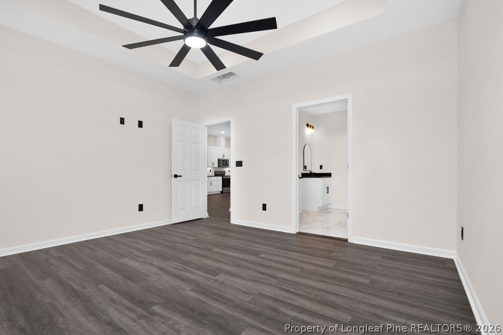 3025 Old Stage Road South Erwin, NC 28339 - Photo 21 of 50 an empty room with wooden floor and windows