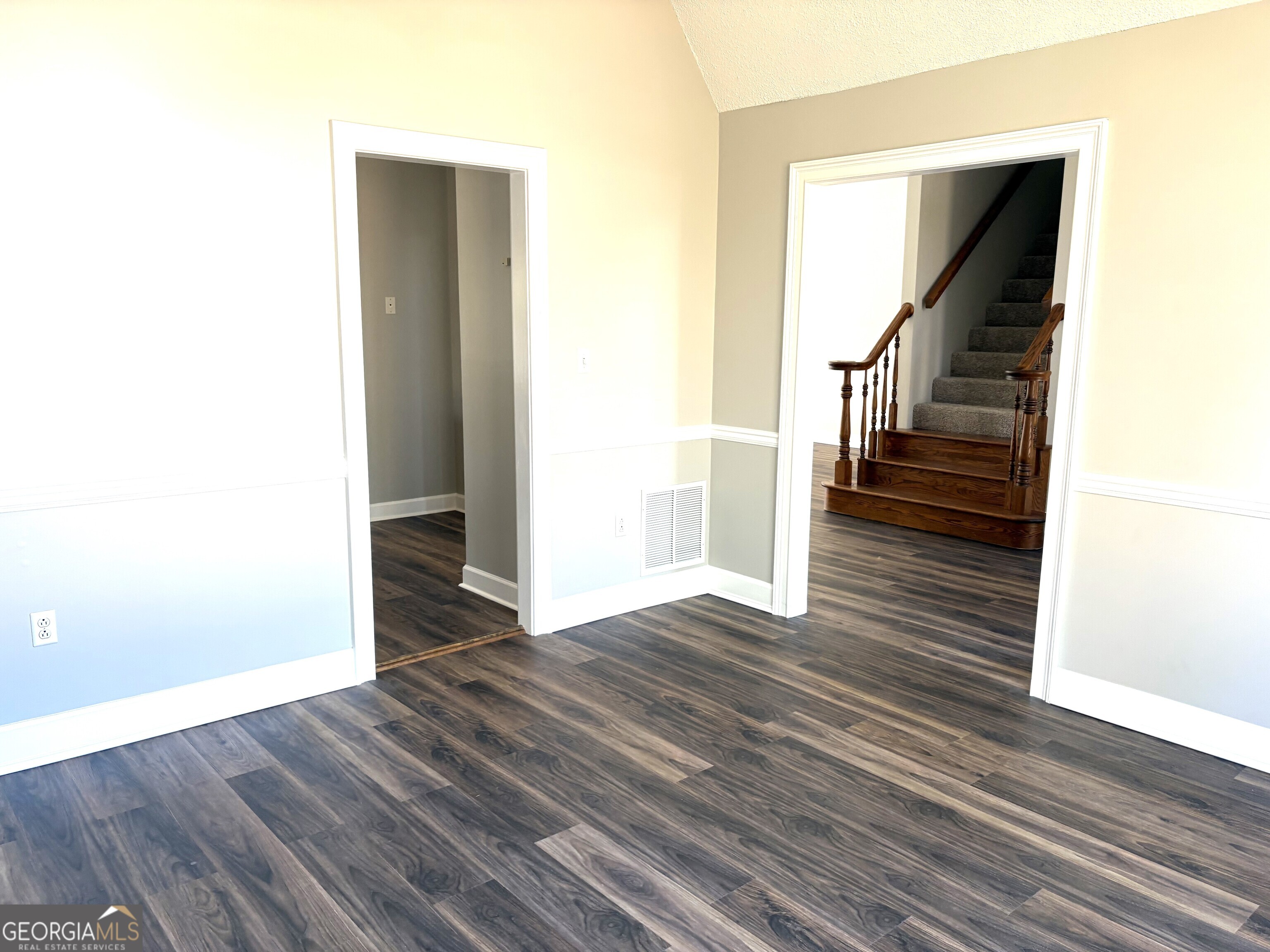 245 Woodland Street Dublin, GA 31021 - Photo 12 of 48 a view of entryway and hall with wooden floor