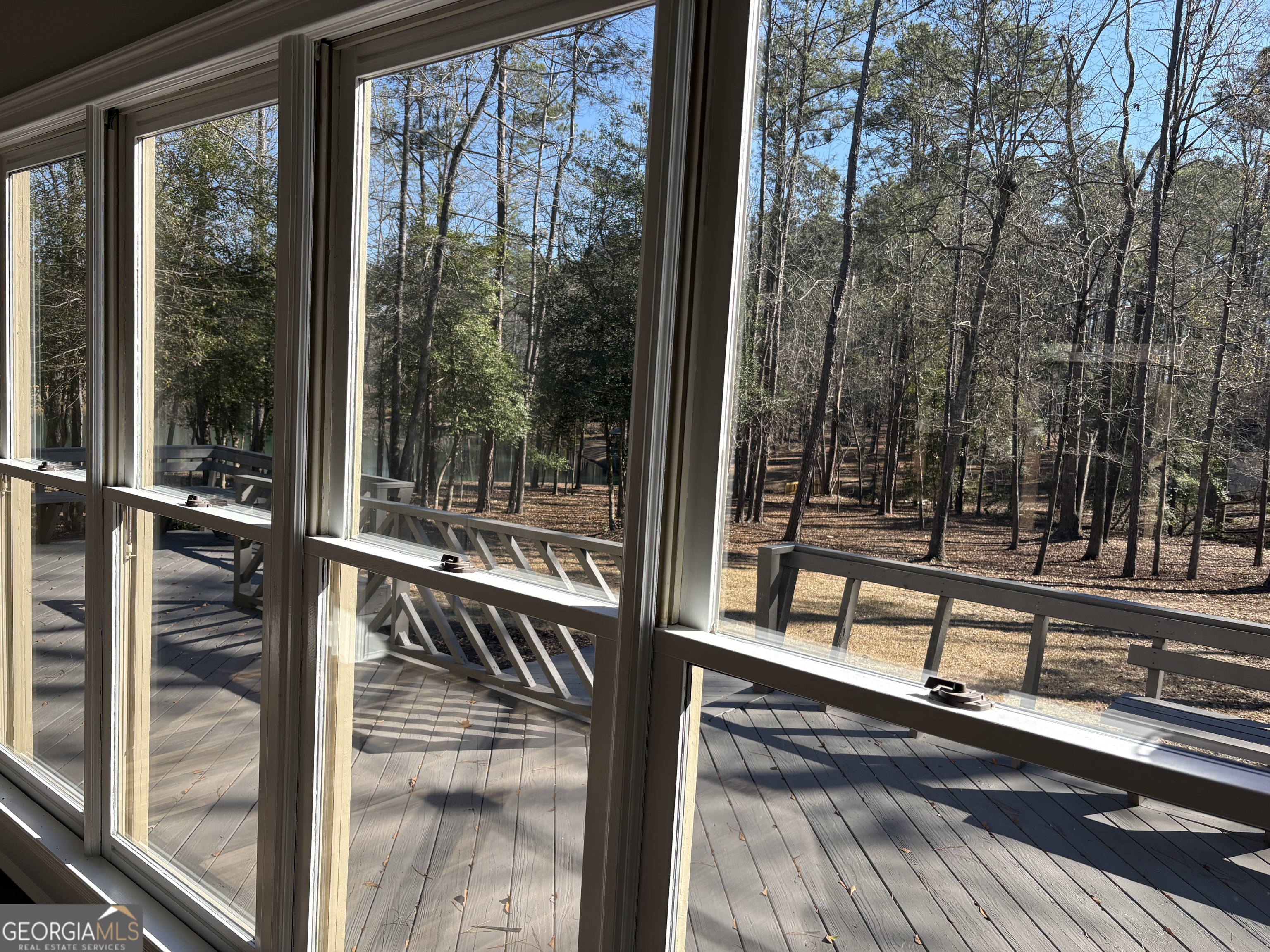245 Woodland Street Dublin, GA 31021 - Photo 16 of 48 a view of a balcony with floor to ceiling windows