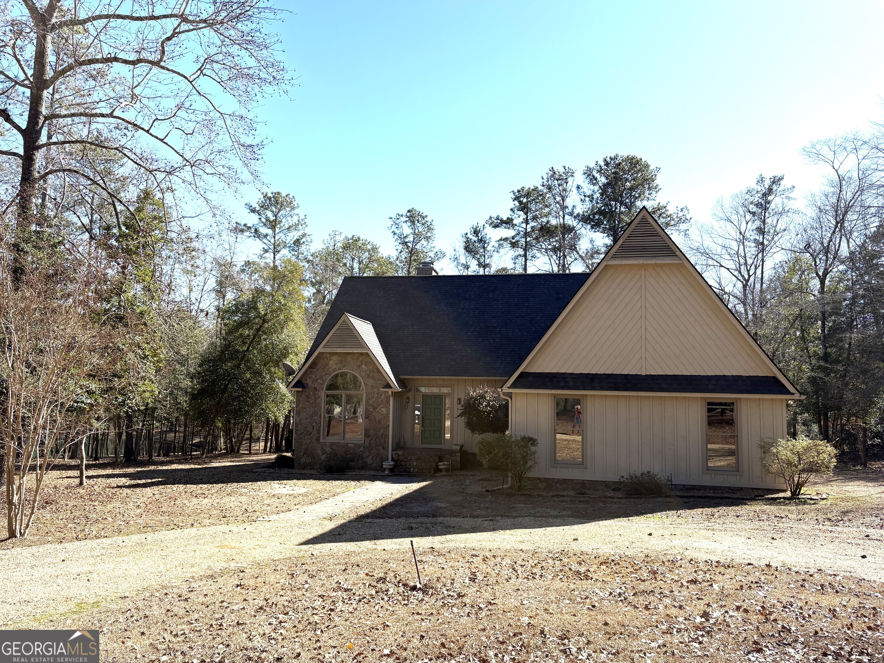 245 Woodland Street Dublin, GA 31021 - Photo 2 of 48 a front view of a house with a yard and garage