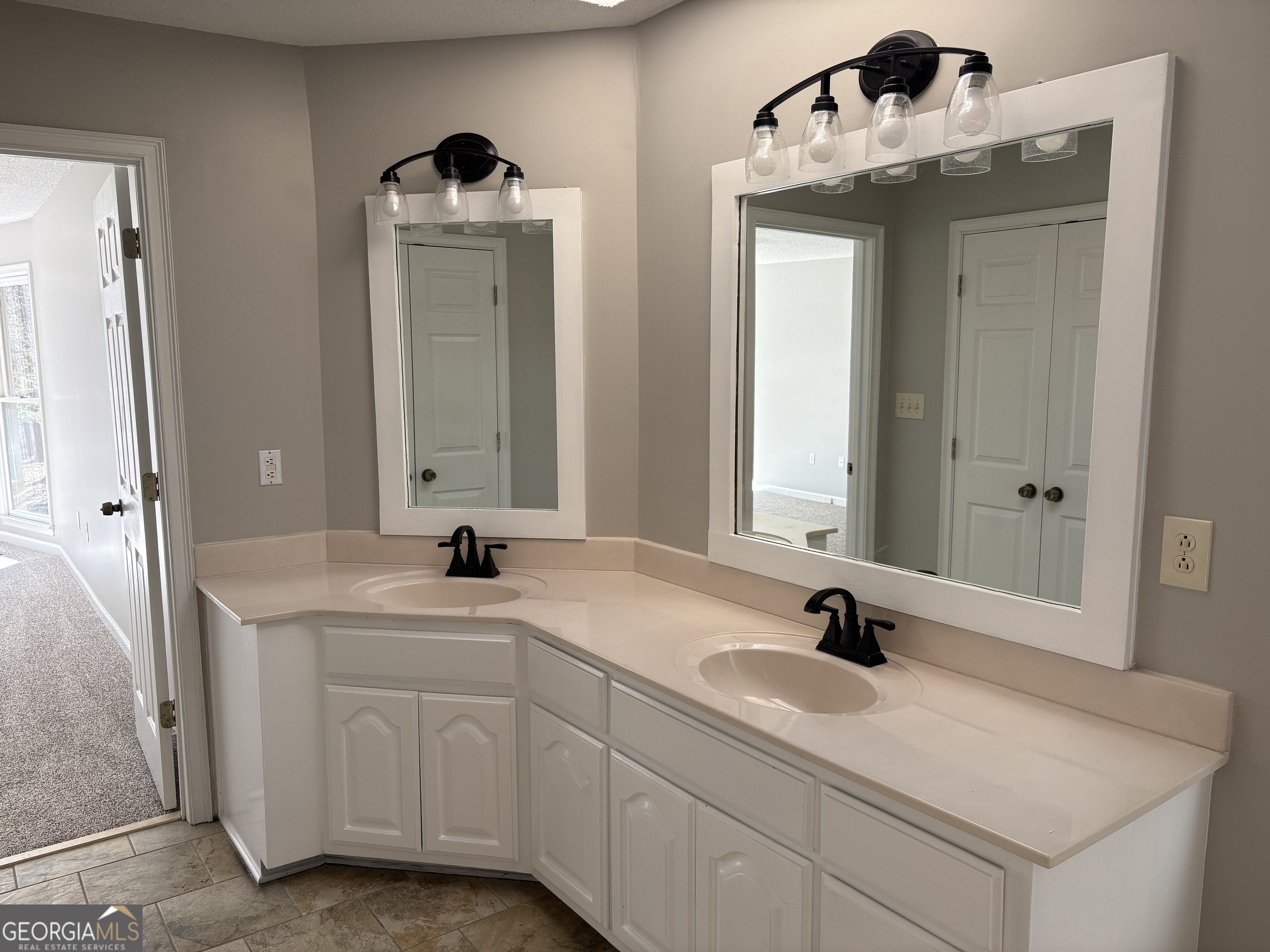 245 Woodland Street Dublin, GA 31021 - Photo 27 of 48 a bathroom with a sink and a mirror