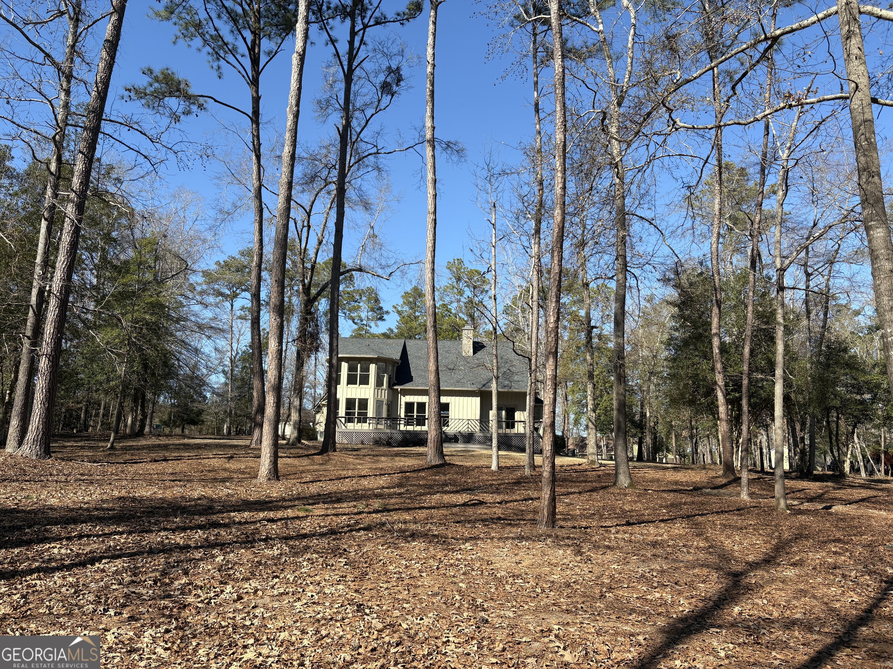 245 Woodland Street Dublin, GA 31021 - Photo 42 of 48 a street view with large trees