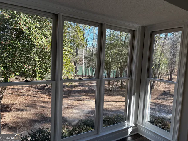 a view of a room with wooden floor and wooden floor