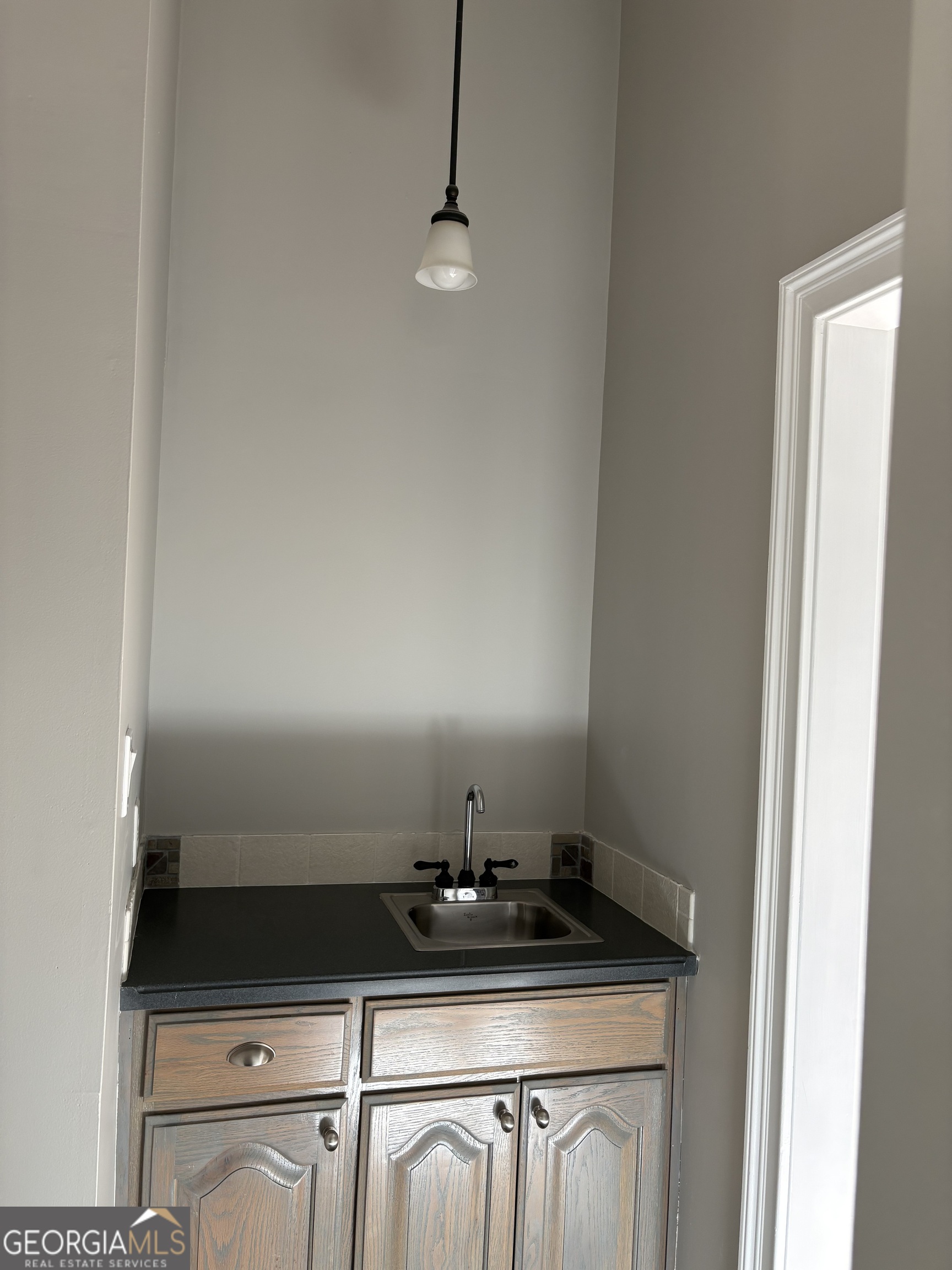 245 Woodland Street Dublin, GA 31021 - Photo 10 of 48 a bathroom with a sink and a mirror