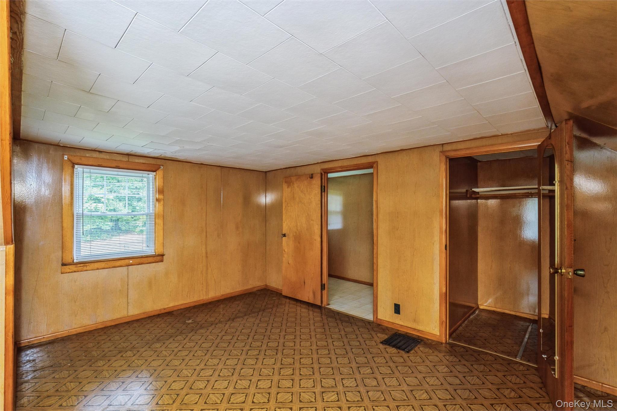 10 Laurel Road Ronkonkoma, NY 11779 - Photo 14 of 21 a view of an empty room with a window
