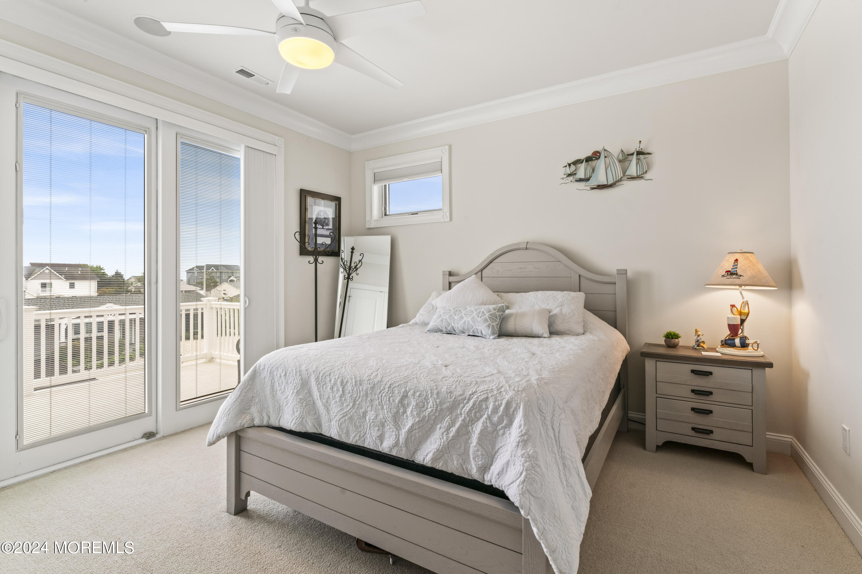 113 Stillwater Road Barnegat, NJ 08005 - Photo 22 of 61 a bedroom with a bed and a window