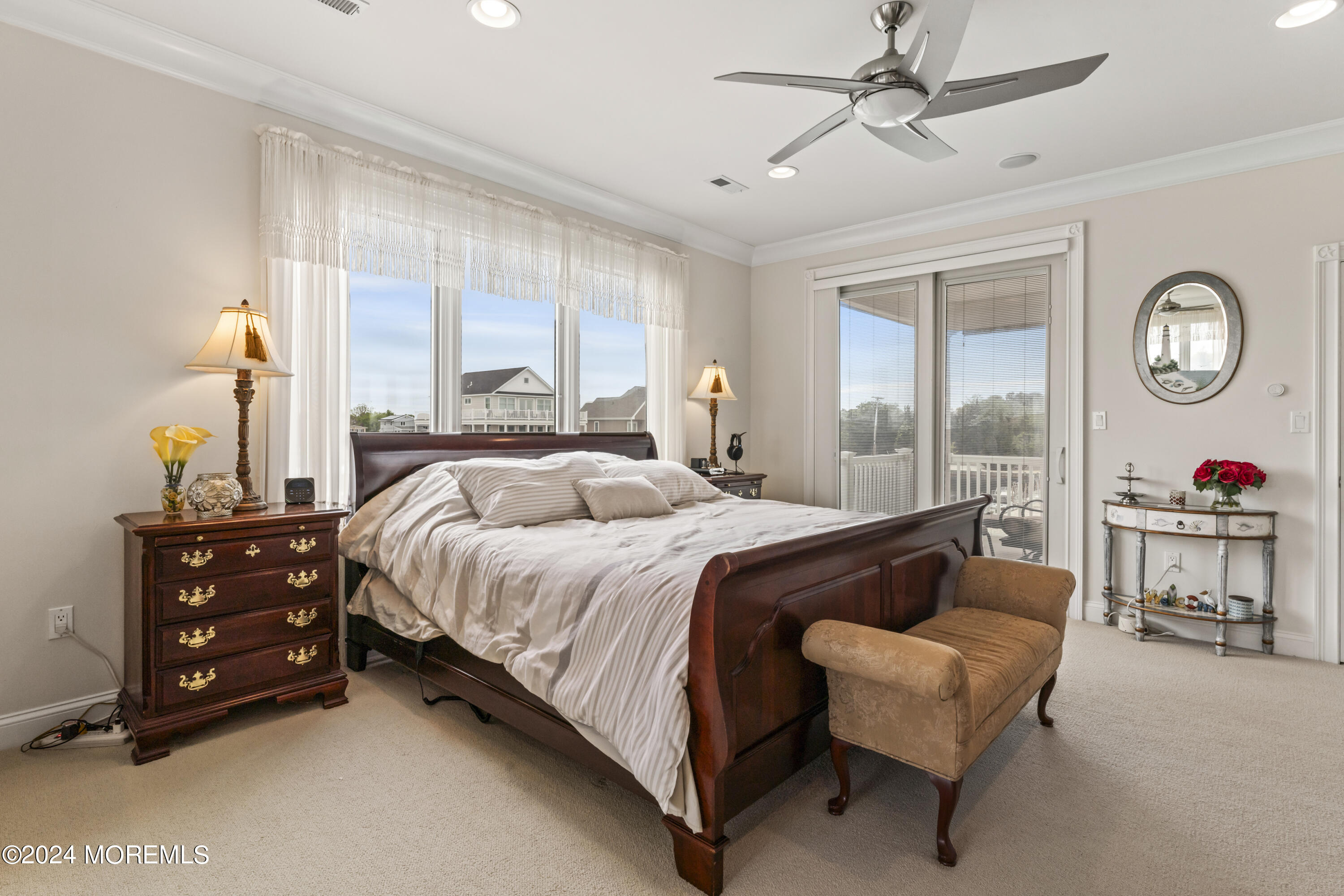 113 Stillwater Road Barnegat, NJ 08005 - Photo 25 of 61 a bedroom with a bed mirror and a large window