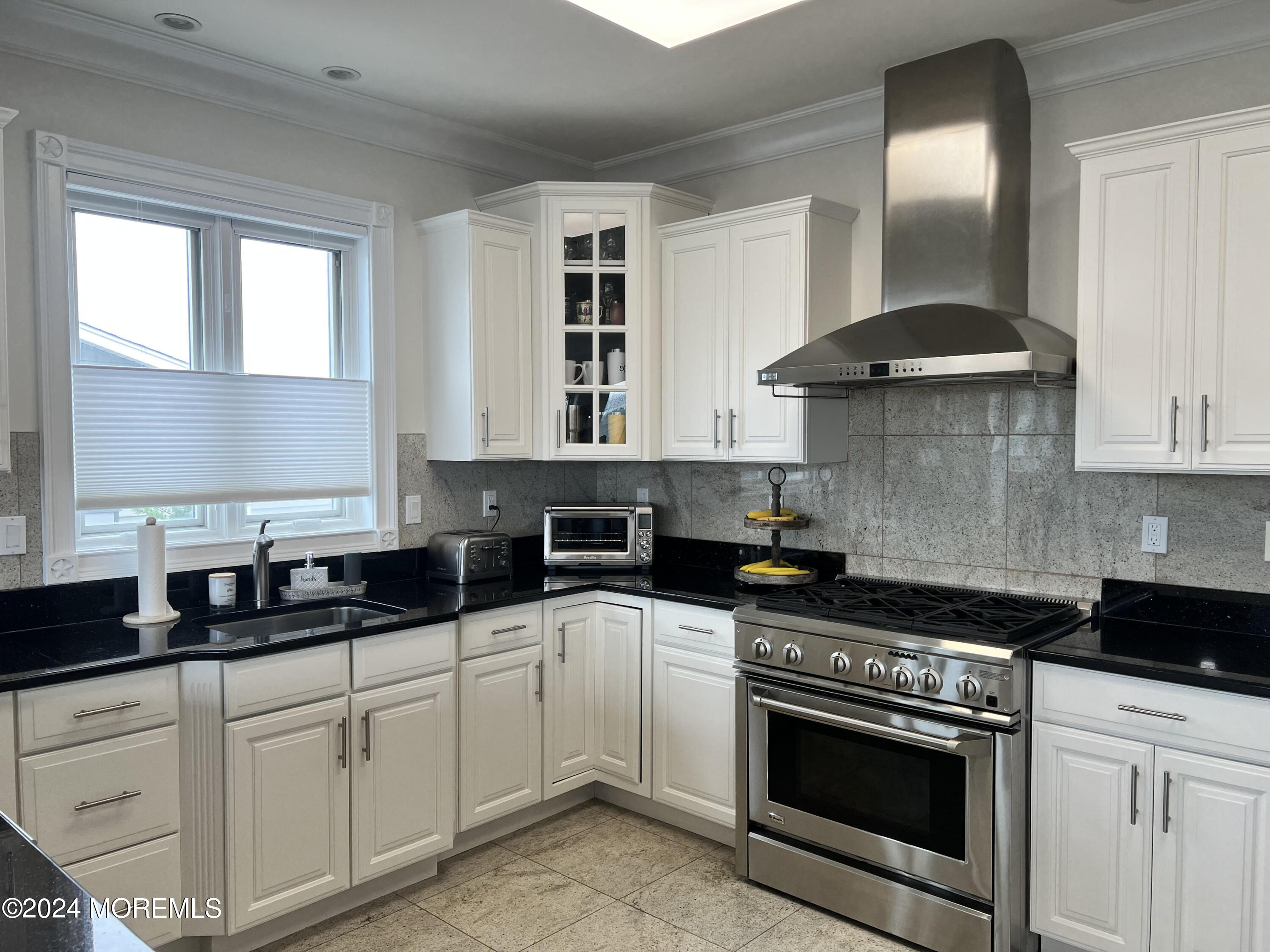 113 Stillwater Road Barnegat, NJ 08005 - Photo 38 of 61 a kitchen with a stove and white cabinets