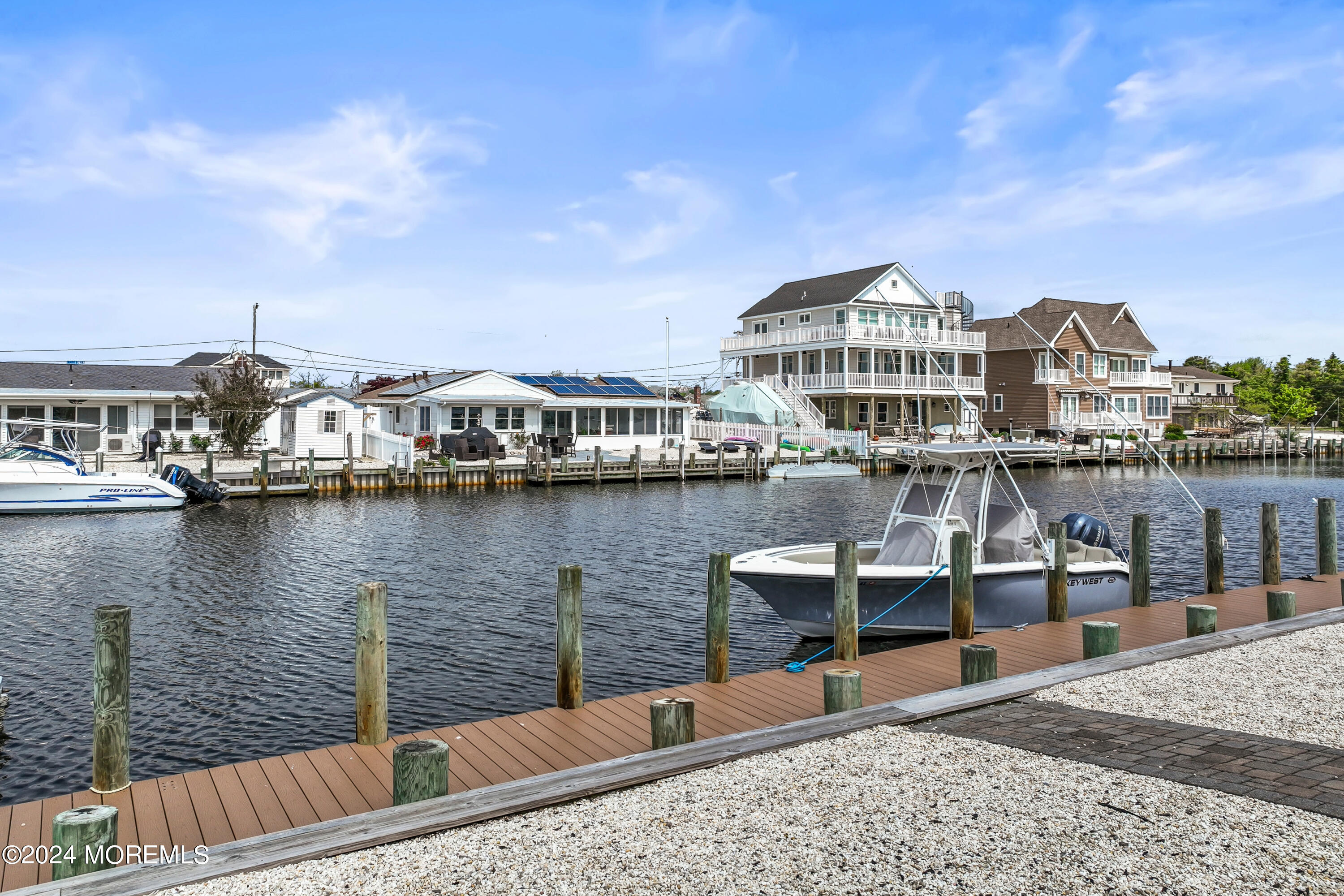 113 Stillwater Road Barnegat, NJ 08005 - Photo 4 of 61 a view of a lake with a terrace