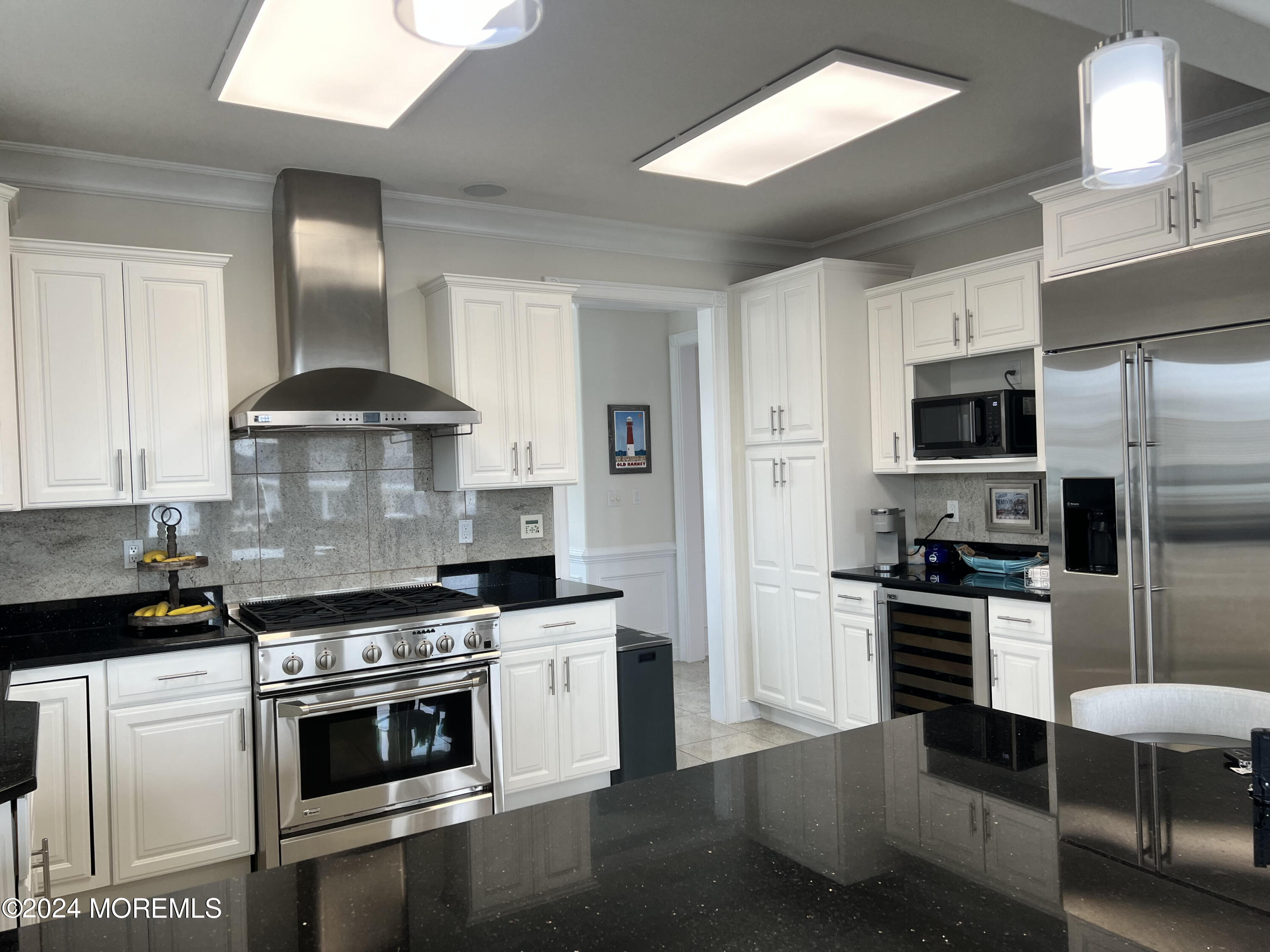 113 Stillwater Road Barnegat, NJ 08005 - Photo 44 of 61 a kitchen with stainless steel appliances a stove a sink dishwasher a refrigerator and a stove