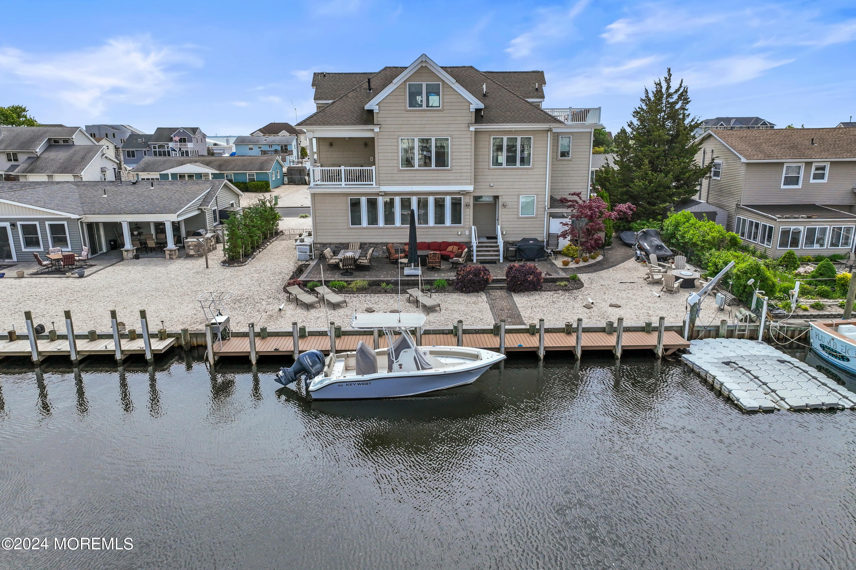 113 Stillwater Road Barnegat, NJ 08005 - Photo 58 of 61 a view of a house with patio and a garden