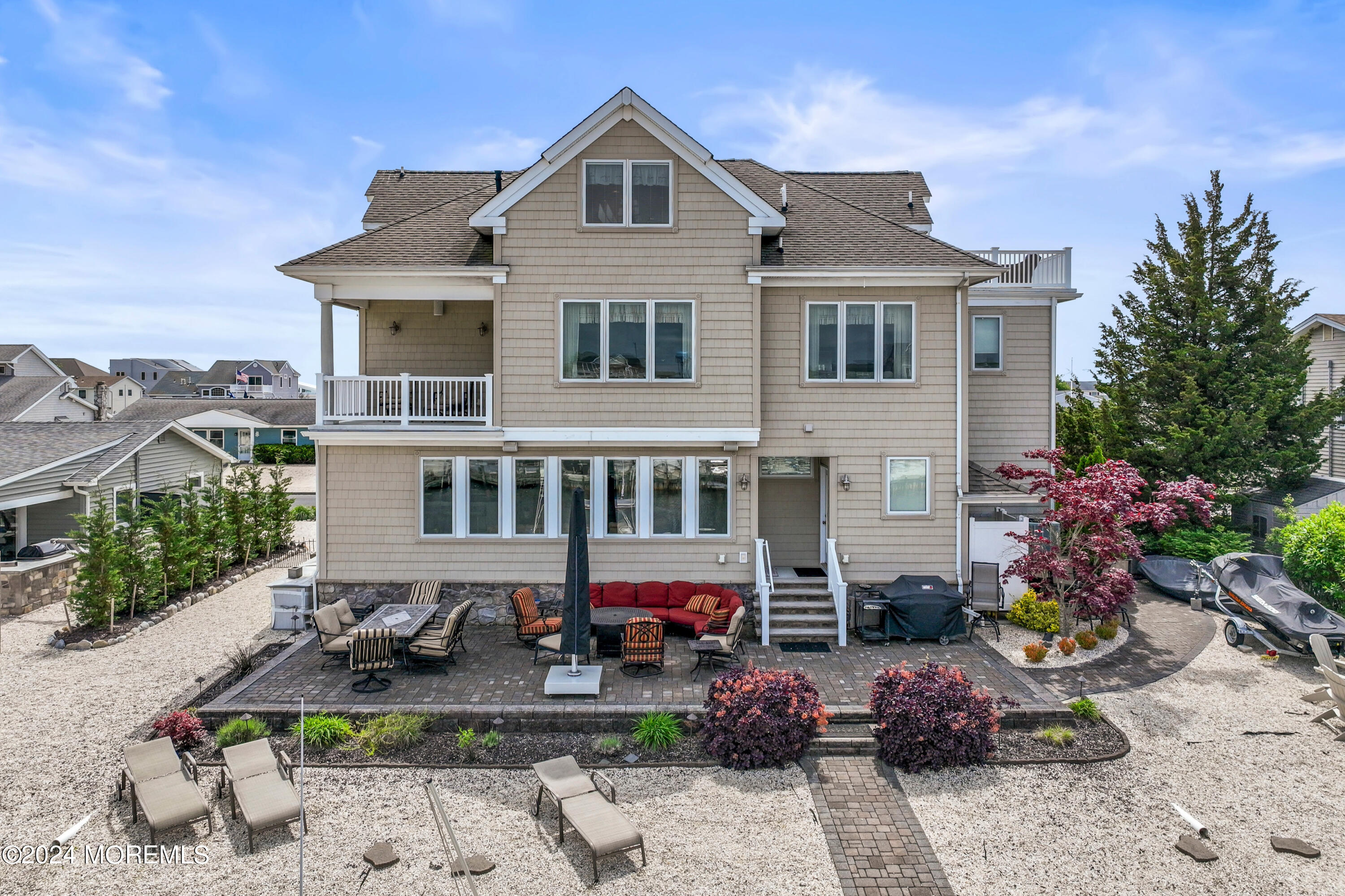 113 Stillwater Road Barnegat, NJ 08005 - Photo 59 of 61 a front view of a house with yard and outdoor seating